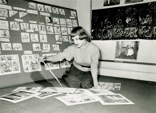 Mary Blair examines concept drawings for "Cinderella." Courtesy of The Walt Disney Company